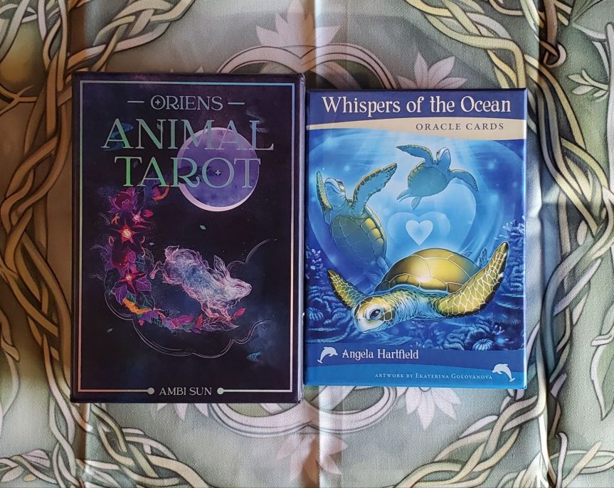 Oriens Animal Tarot by Ambi Sun and Whispers of the Ocean Oracle by Angela Hartfield.